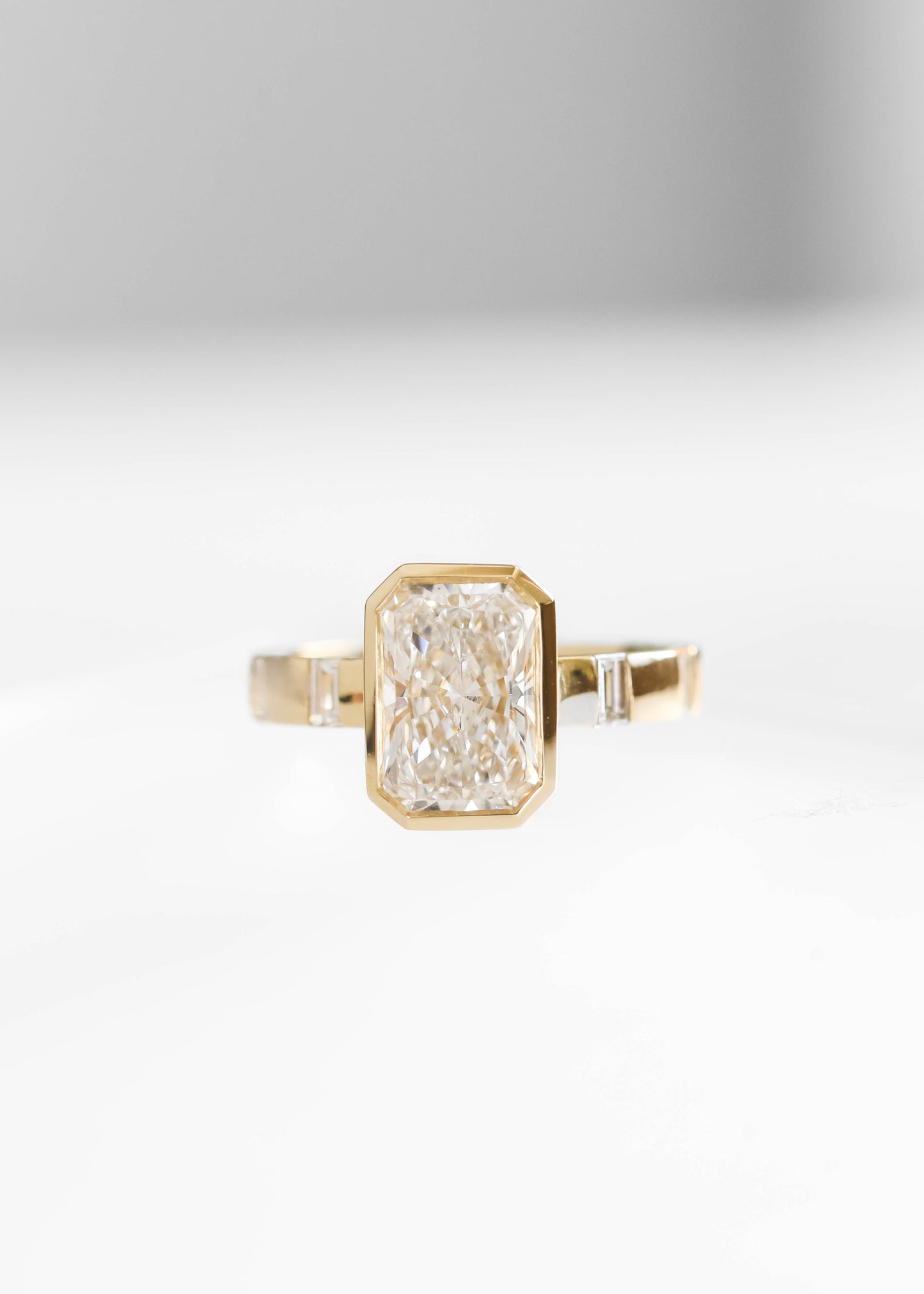 radiant cut lab diamond engagement ring, 14k yellow gold engagement ring, Lennon setting ring, bezel radiant diamond ring, baguette side stone engagement ring, modern engagement ring, lab grown diamond ring, minimalist bridal jewelry