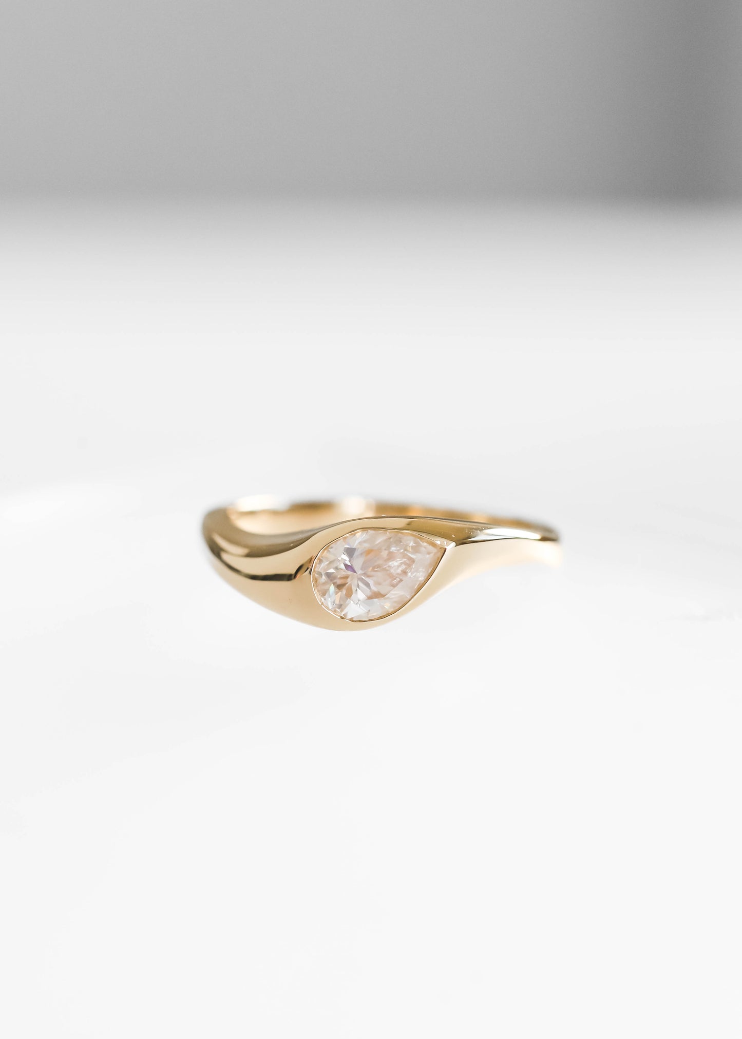 pear moissanite engagement ring, 14k yellow gold engagement ring, Apollo setting ring, sculptural engagement ring, minimalist gold ring, alternative bridal ring, modern pear ring, bezel inspired engagement ring