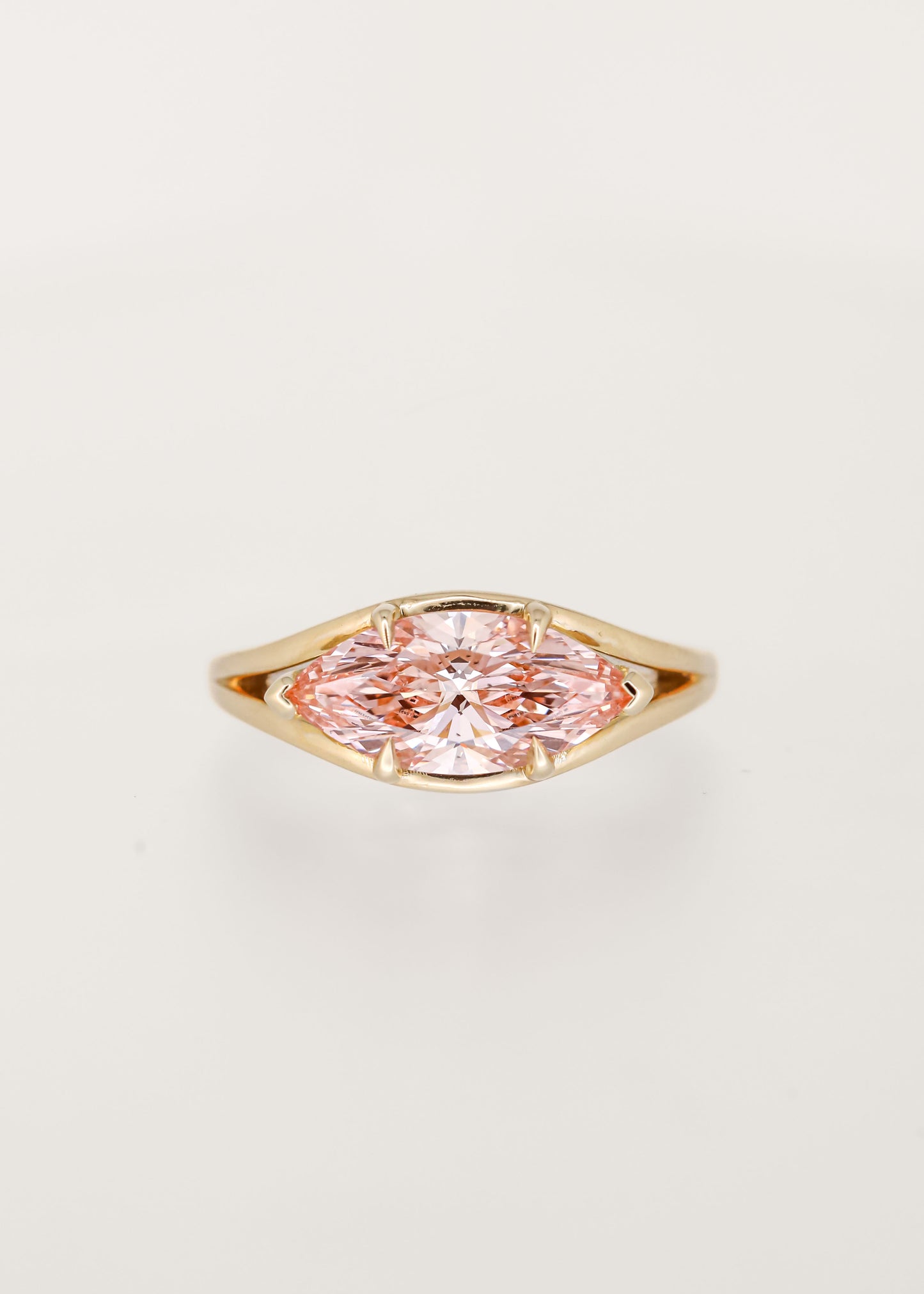 Unique east west marquise cut pink lab grown diamond engagement ring in 14K yellow gold with a split shoulder band