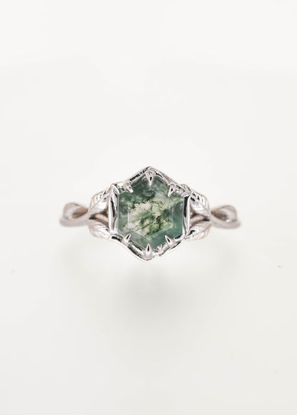 Nature inspired hexagon cut moss agate engagement ring in 14K white gold with a six prong basket and sculpted leaf and vine band