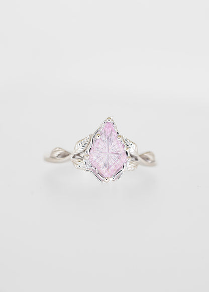 Starbright cut purple sapphire engagement ring in 14K white gold with a carved leaf gallery and twisted vine band