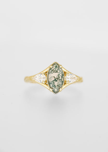 Marquise cut moss agate engagement ring in 14K yellow gold with pear diamond side stones and milgrain detail
