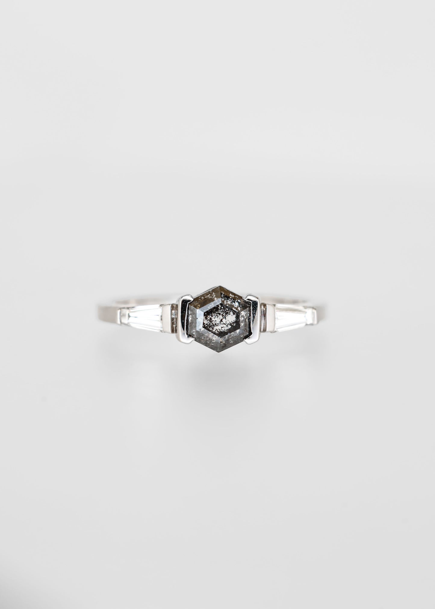Hexagon salt and pepper diamond engagement ring in 14K white gold with tapered baguette accent stones