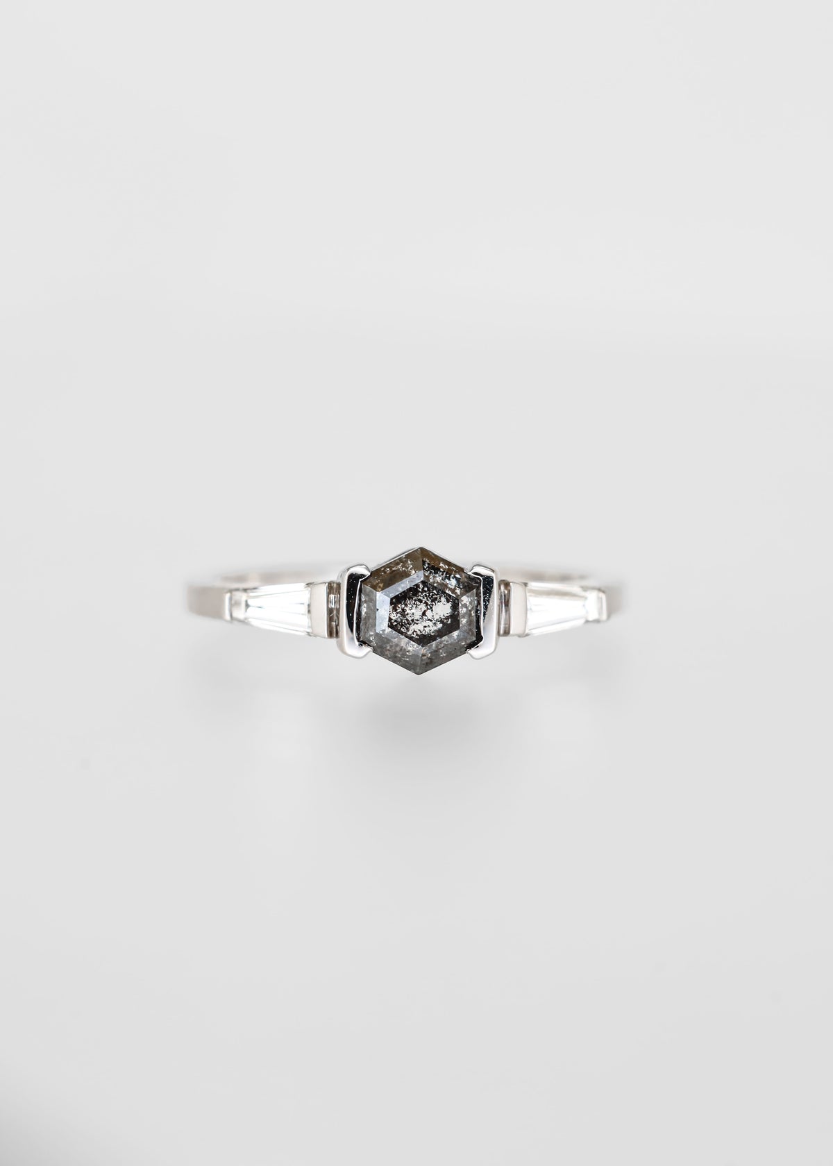 Hexagon salt and pepper diamond engagement ring in 14K white gold with tapered baguette accent stones