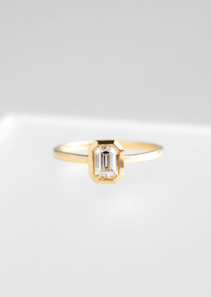 The Leda | .64ct Emerald Cut Diamond | Yellow Gold