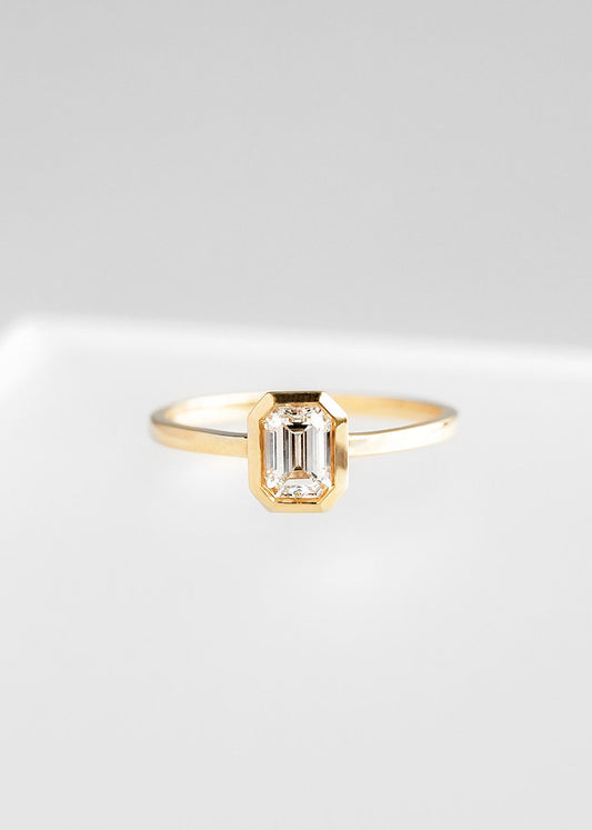 The Leda | .64ct Emerald Cut Diamond | Yellow Gold