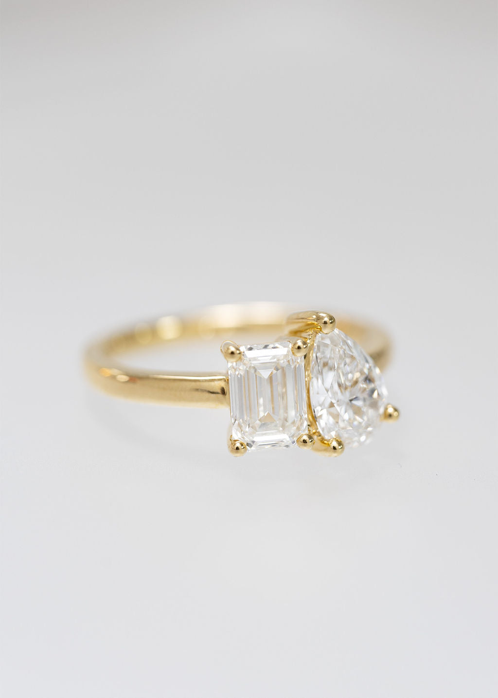 The Vela Ring | 1.03ct Lab-Grown Emerald Cut + 1.02ct Lab-Grown Pear | Yellow Gold