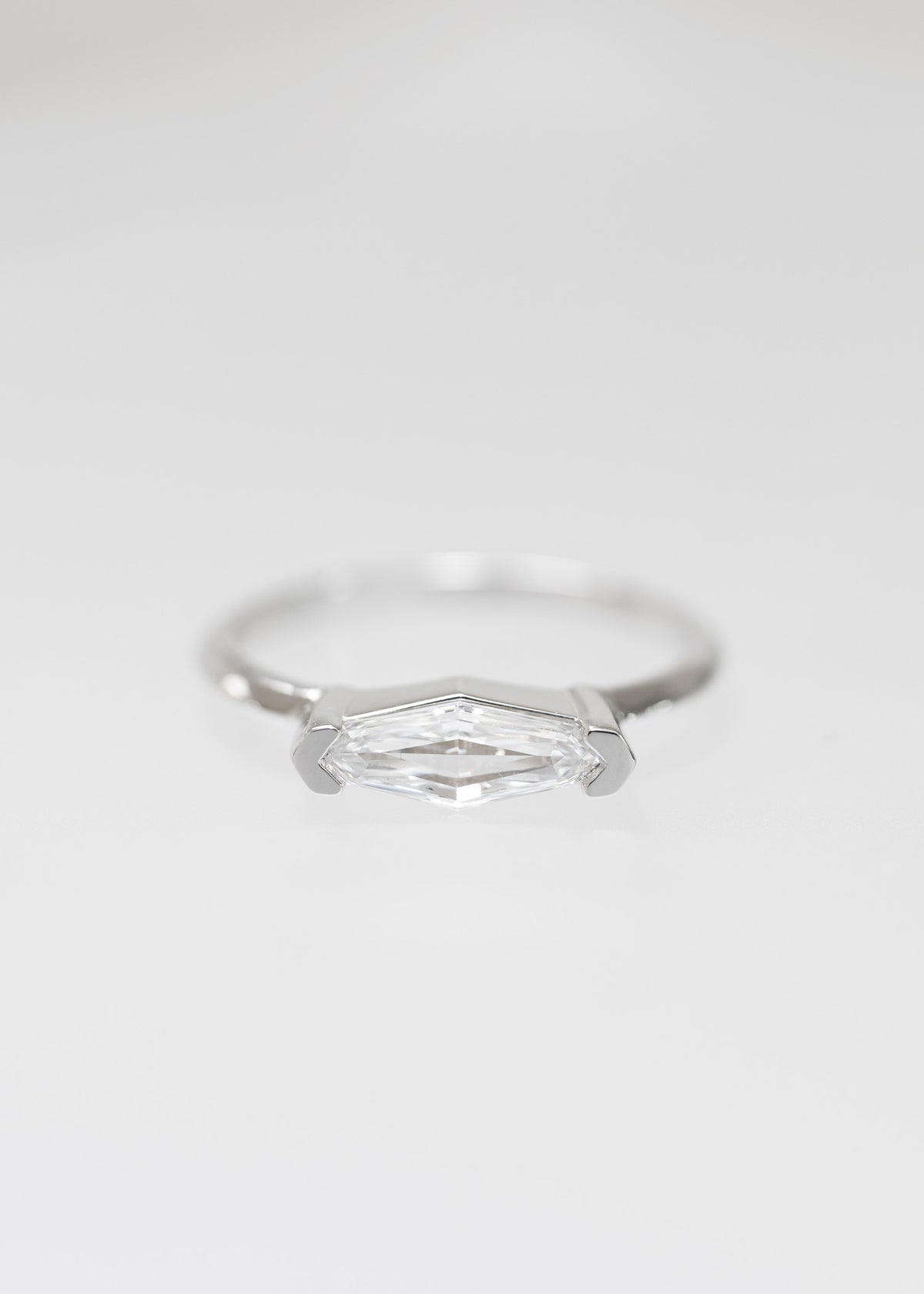 Minimal east west step marquise natural diamond engagement ring in 14K white gold with half bezel setting