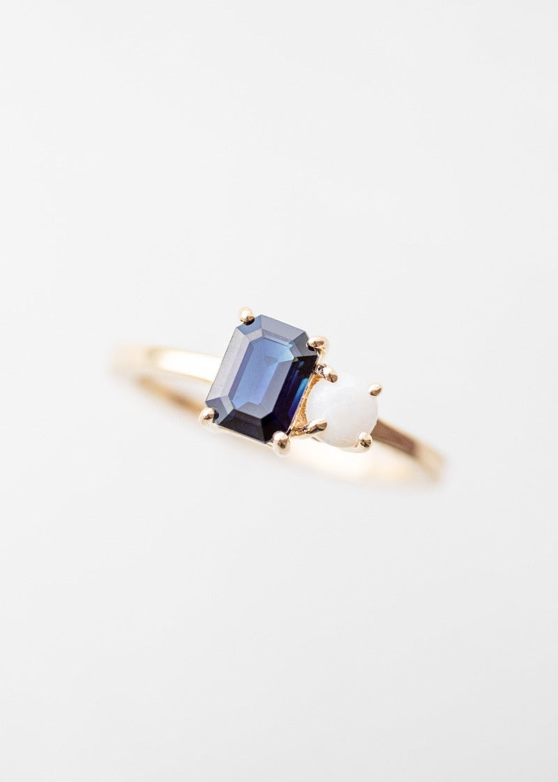 The Vela Ring | 1.09ct Emerald Cut Sapphire + .18ct Round Opal | Yellow Gold